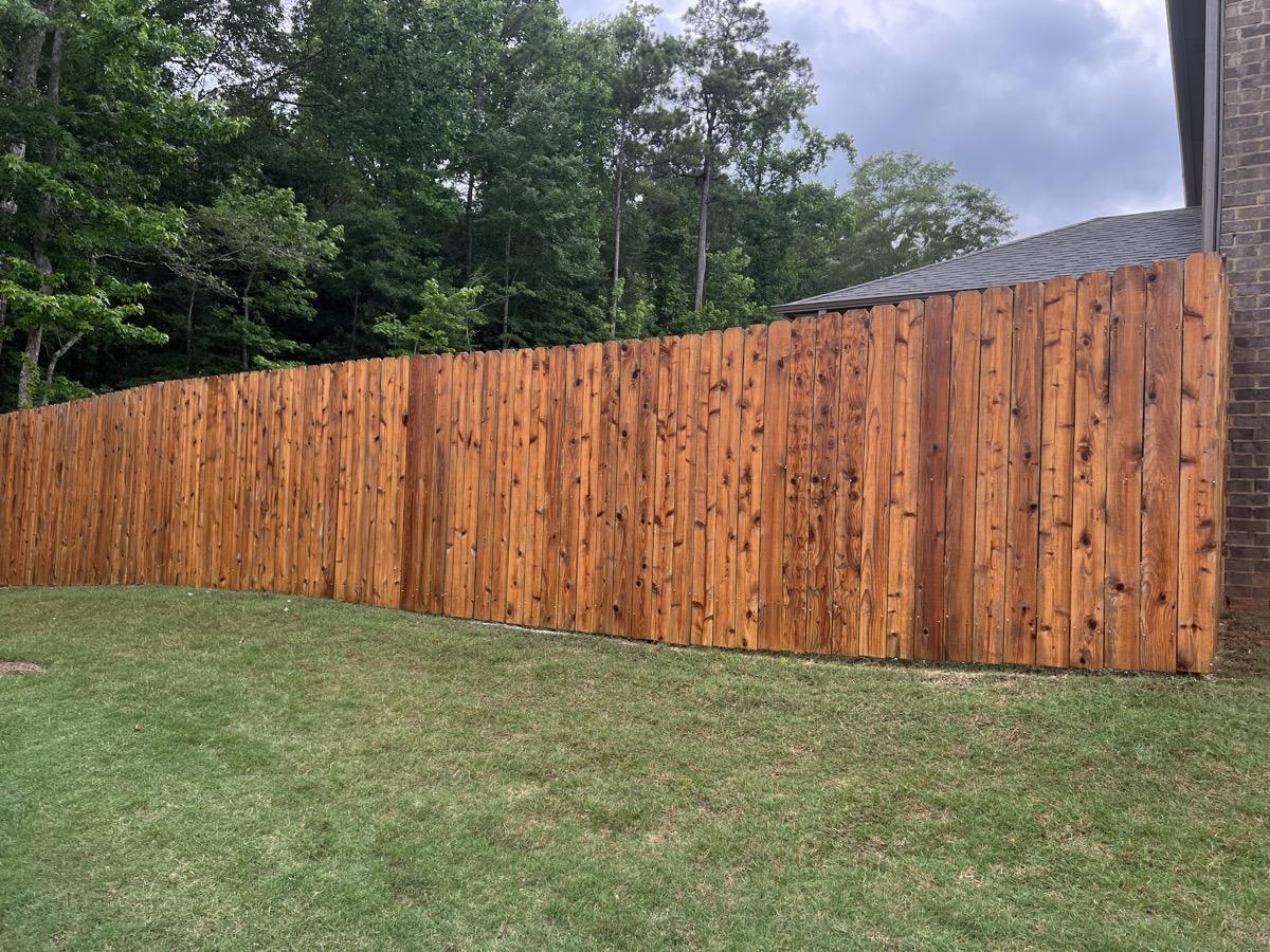 Fence restored and stained by AFR
