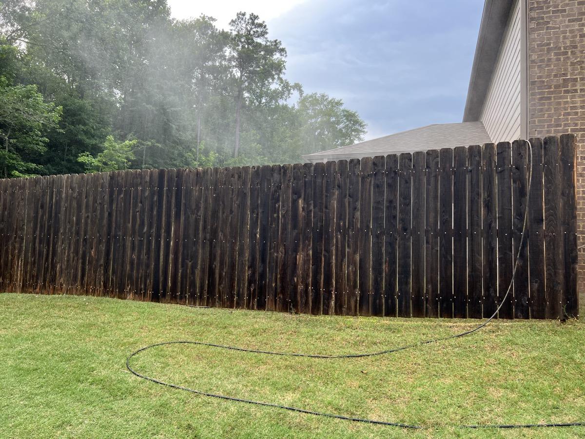 Dirty mold-covered fence before cleaning