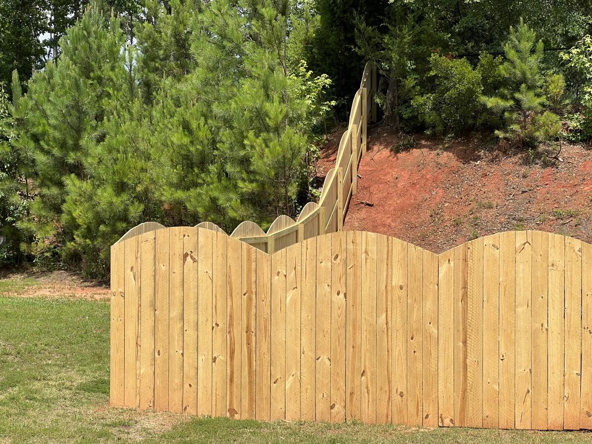 New bare cedar fence before staining